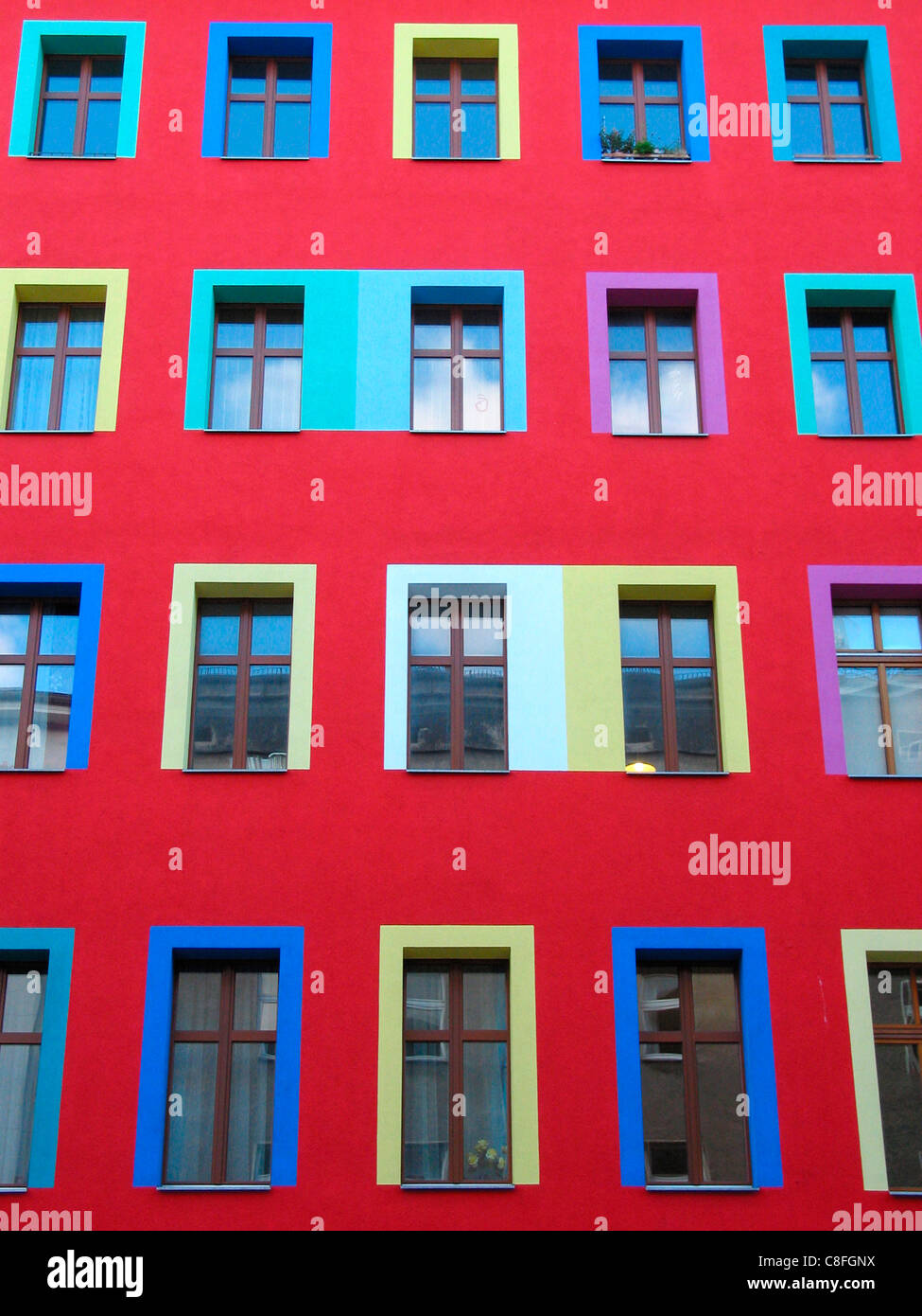 Red house wall coloured window frames berlin germany windows