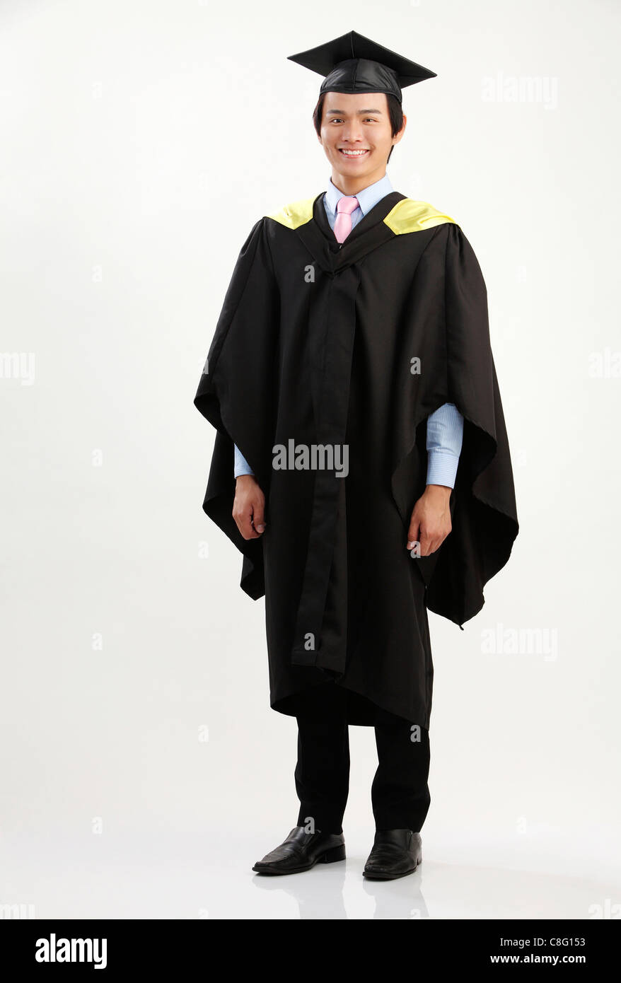 Full Length Of The Man In The Graduation Gown Stock Photo, Royalty ...