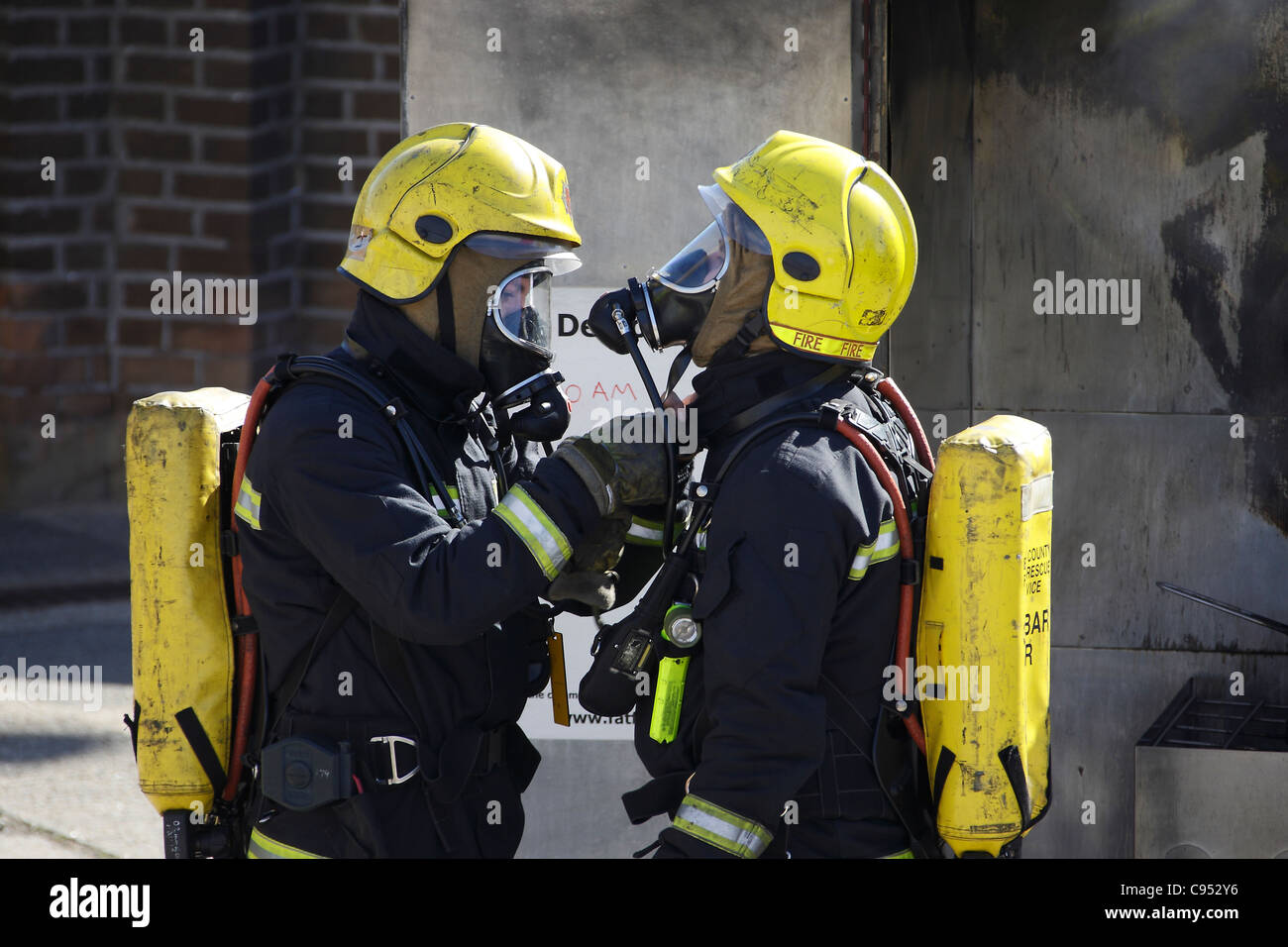 Firefighters checking their Breathing Apparatus during a training Stock