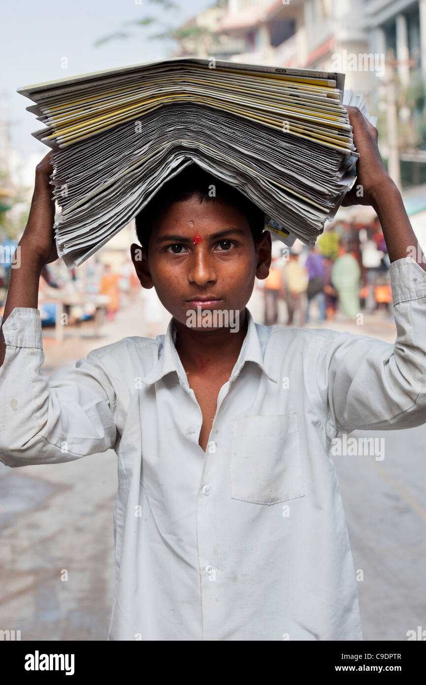 indian-paper-boy-with-papers-on-his-head