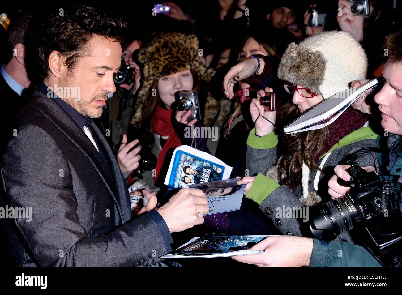 Lead Actor Robert Downey Jr. meets fans and signs autographs at the