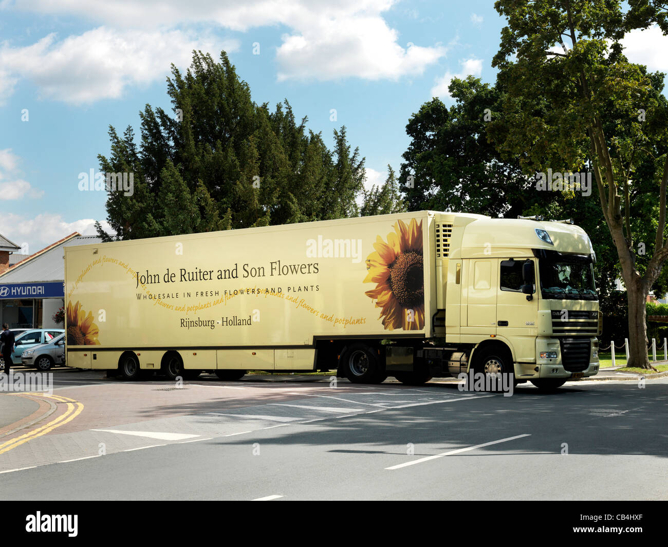 Oversized Dutch Flower Lorry Delivering Flowers In Small Village Surrey England Oversized Dutch Flower Lorry Delivering Flowers In Small Village Surrey England