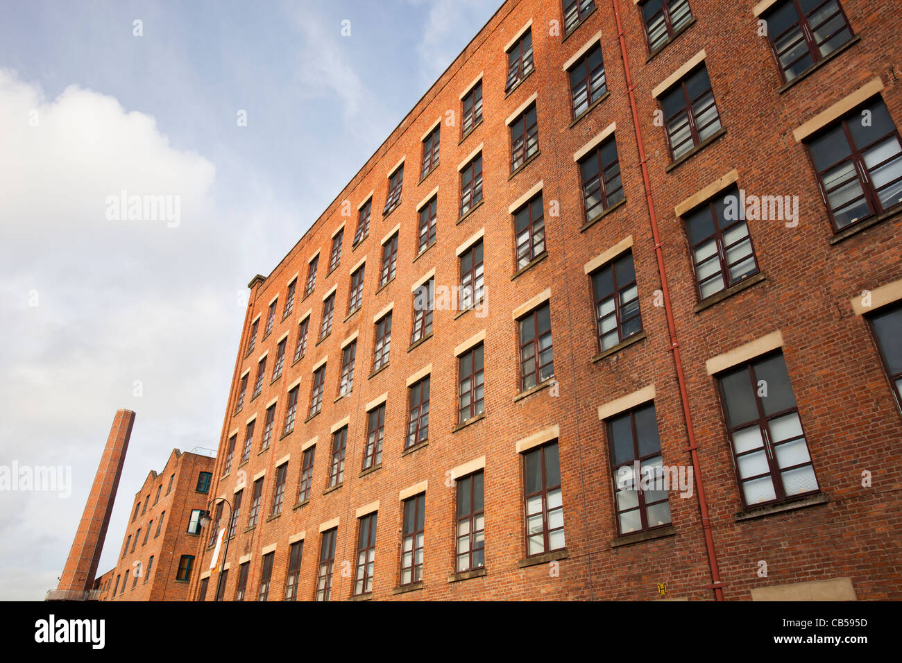 An old cotton mill in Manchester, converted into apartments, UK Stock Photo, Royalty Free Image