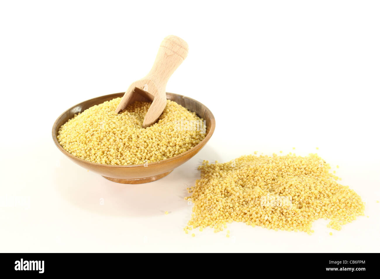 fresh dried millet in a bowl with bushel Stock Photo, Royalty Free
