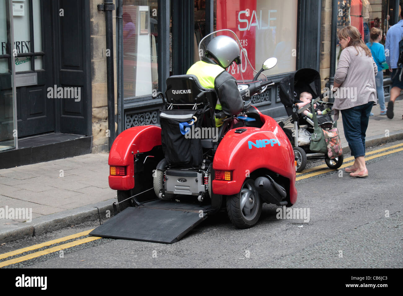 a-man-in-a-wheelchair-entering-a-nippi-t