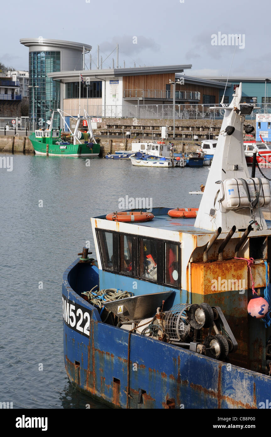 Brixham Harbour With Fish Market In BackgroundTrawler Bm522 Stock
