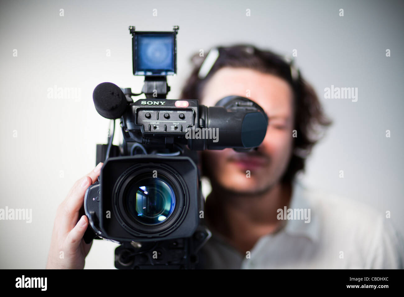 Cameraman with camera. TV, news, journalism, video, recoring, record