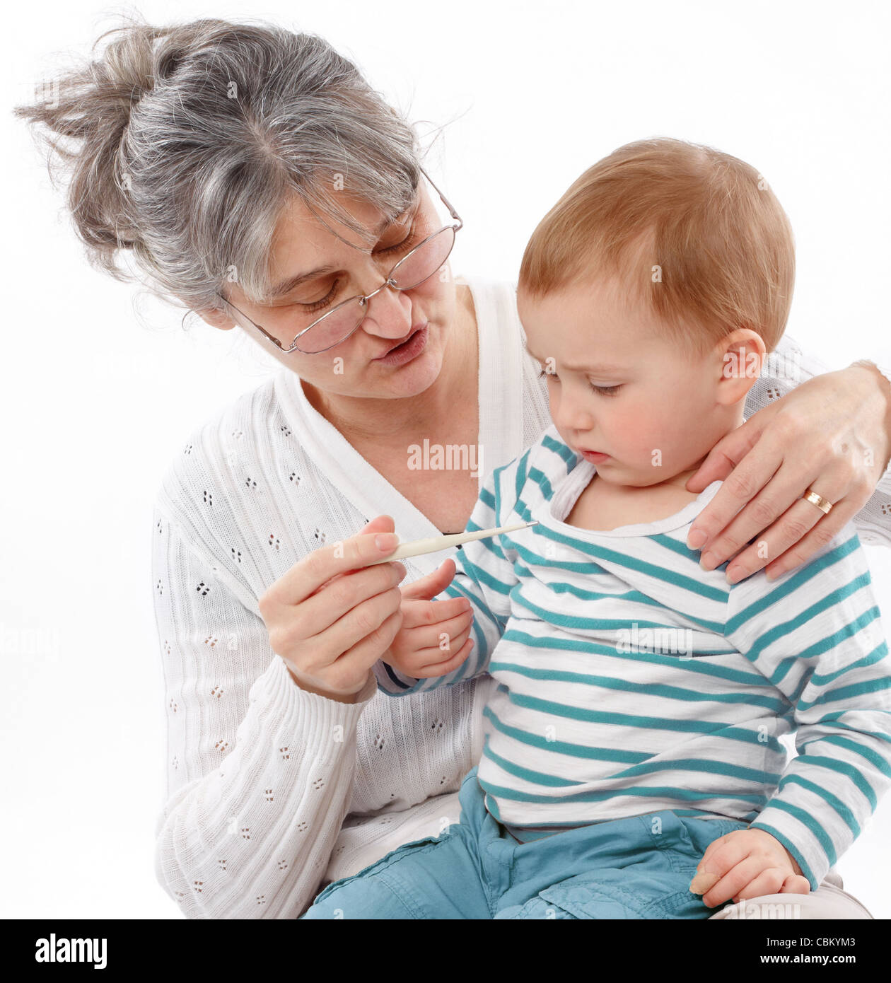 Granny Holds Grandson And Checks His Temperature Stock Photo Alamy