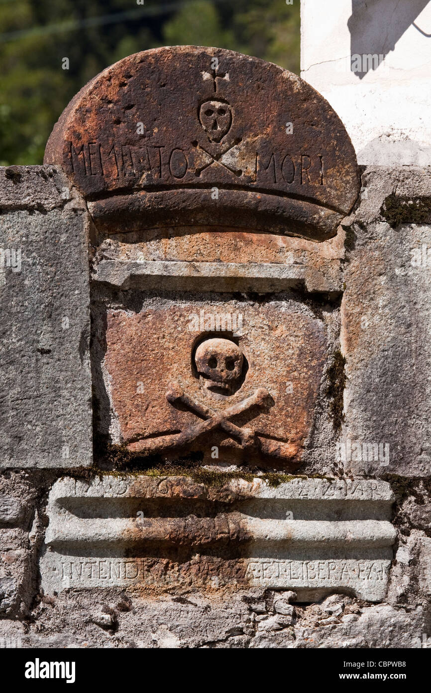 Skull and crossbones tomb stone built into the wall belonging to the Stock Photo, Royalty Free