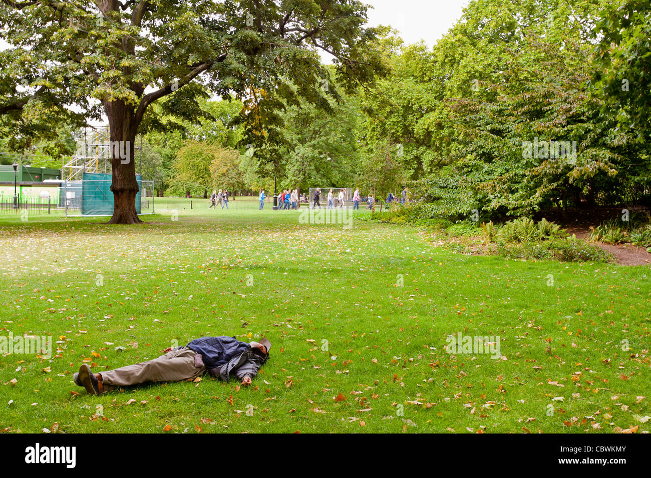 Homeless Man Sleeping In St James Park London England While