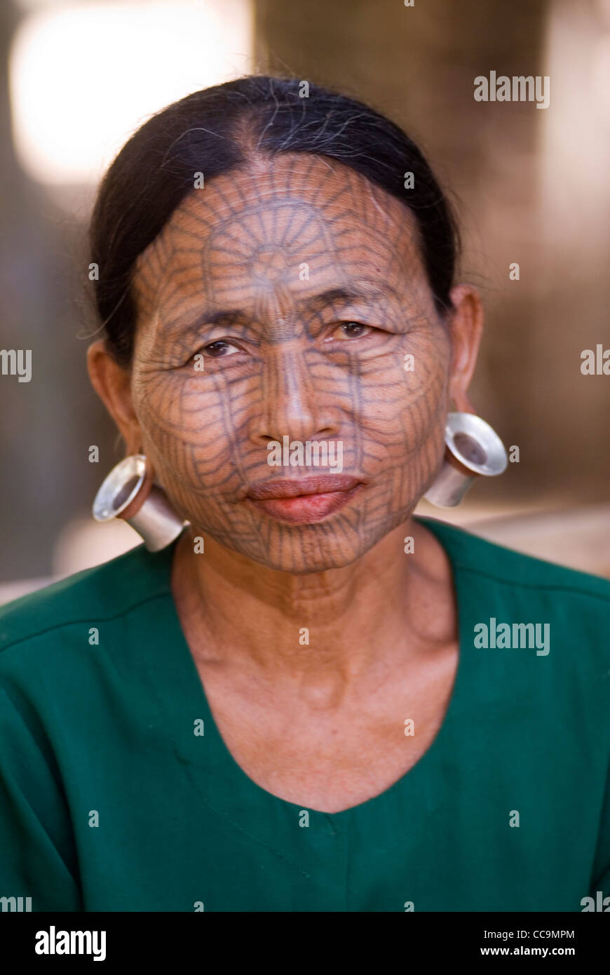chin tribal woman with spider web design tattooed face myanmar chin tribal woman with spider web design tattooed face myanmar