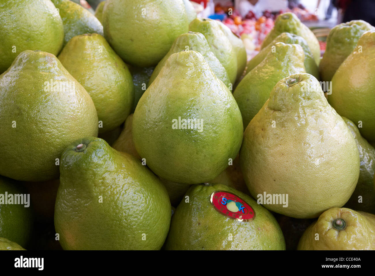 large green pomelos on a fresh asian fruit stall in aberdeen hong