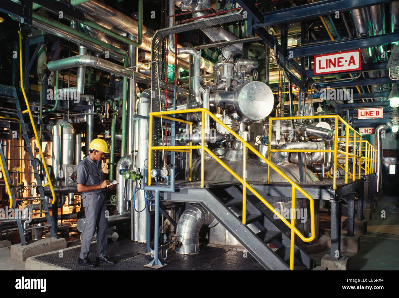 HMA 85845 Engineer Taking A Reading In Chemical Factory Plant Stock hma-85845-engineer-taking-a-reading-in-chemical-factory-plant-stock