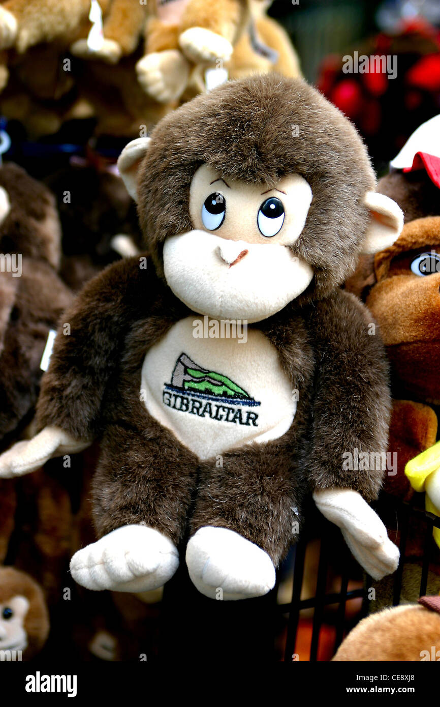 Gibraltar Souvenir monkey on rack outside shop Stock Photo, Royalty