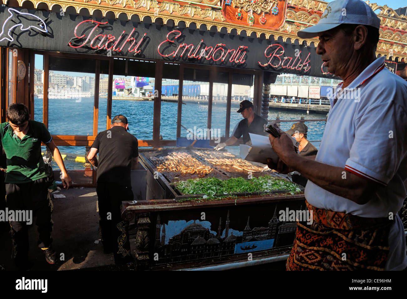 Boats sell selling Balik Ekmek fish mackerel bread sandwich Galata