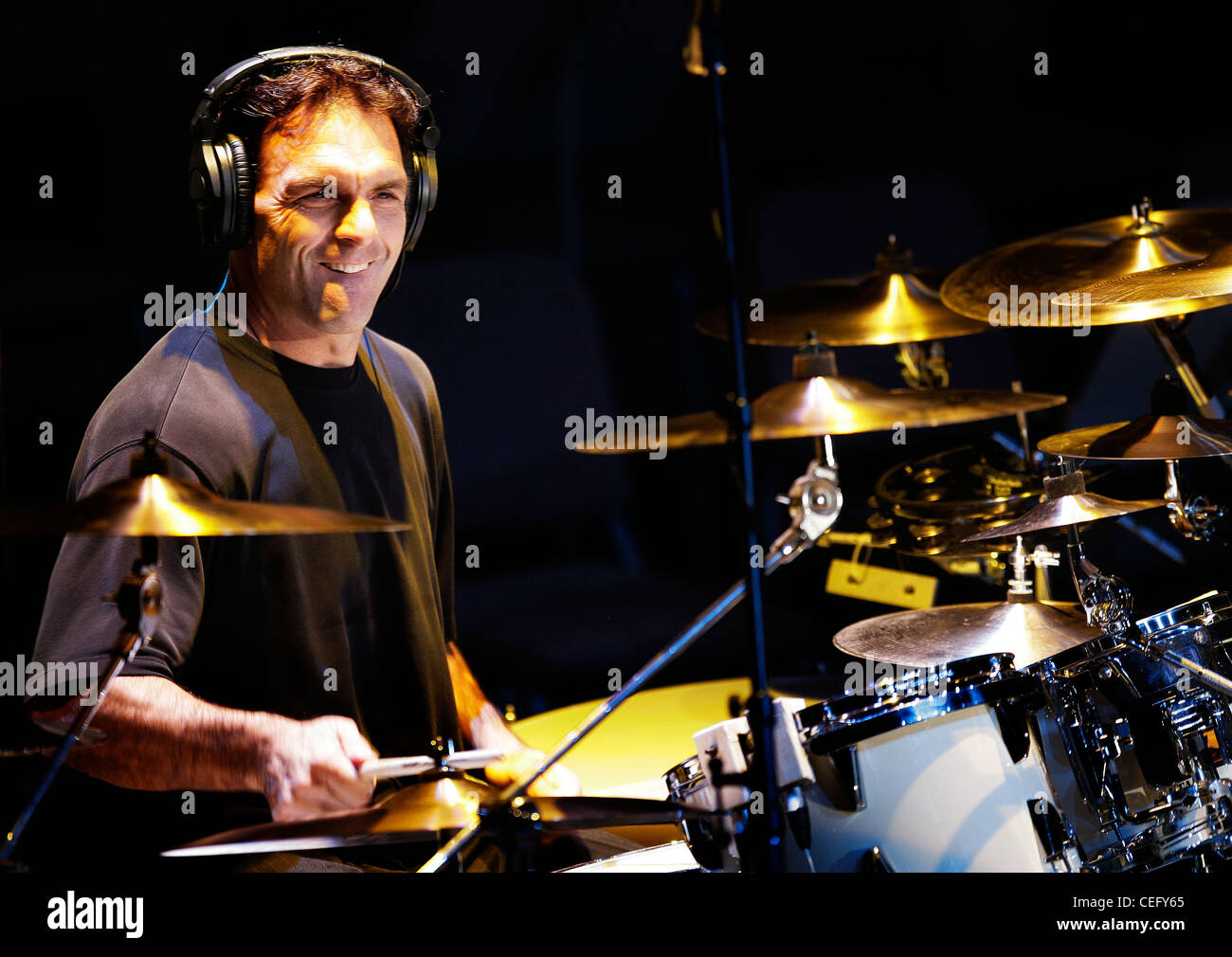 Former NFL quarterback Doug Flutie sits in on drums with the band Stock