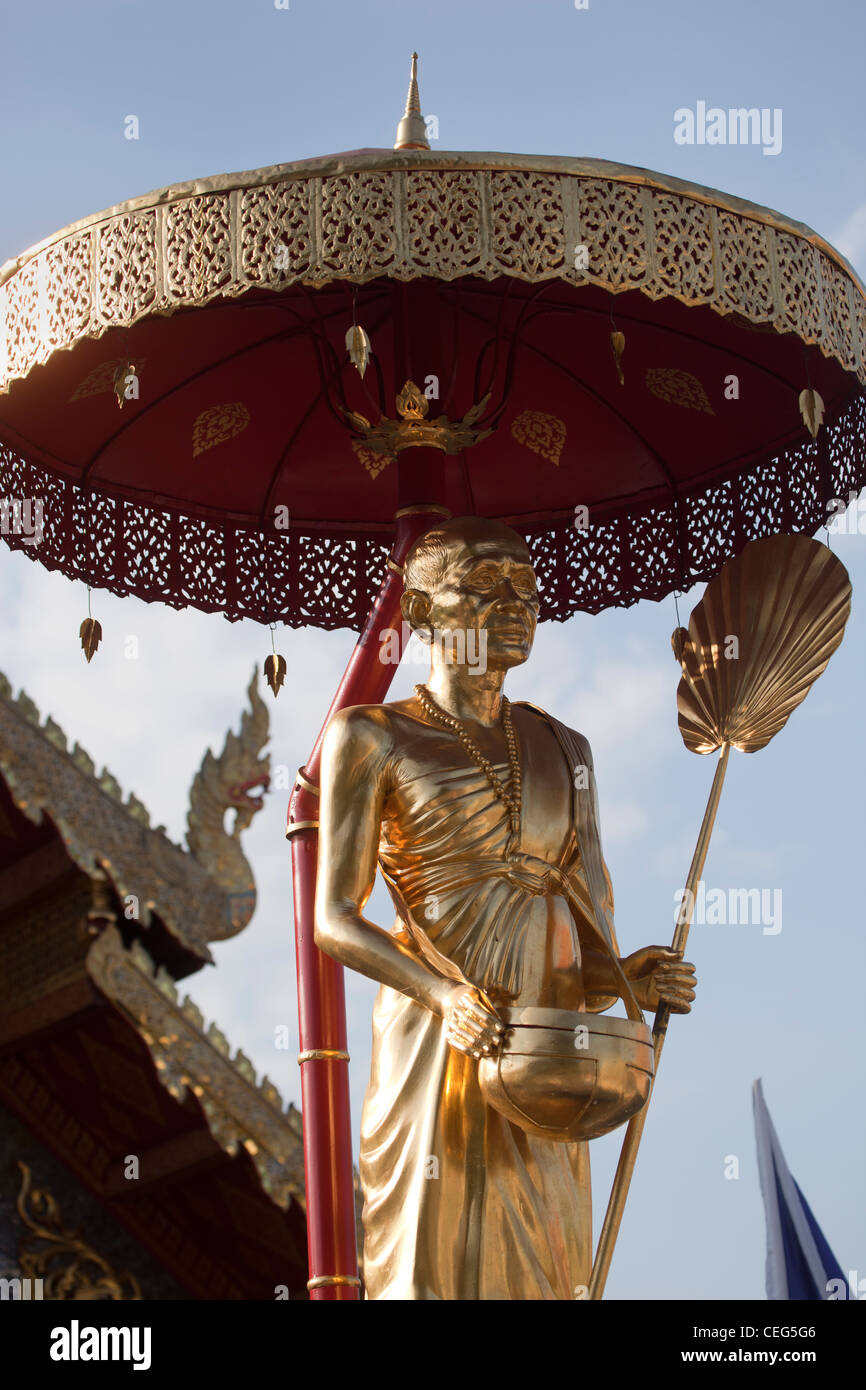 Gold Buddha Statue under umbrella or parasol at Wat Phra Singh Temple