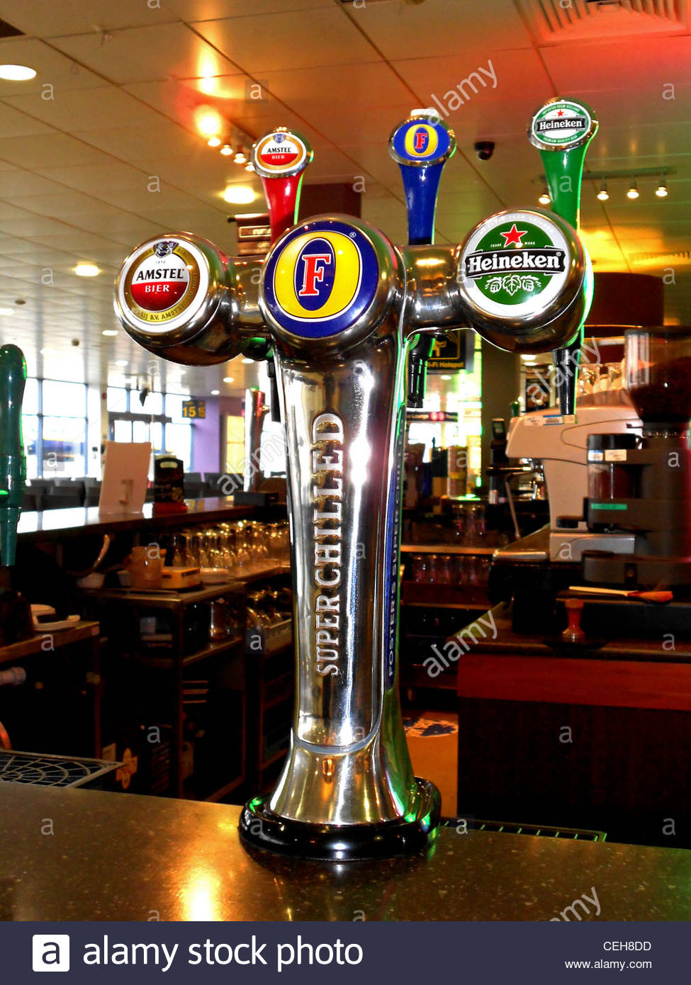 Beer taps on bar in departure lounge, East Midlands Airport, Castle
