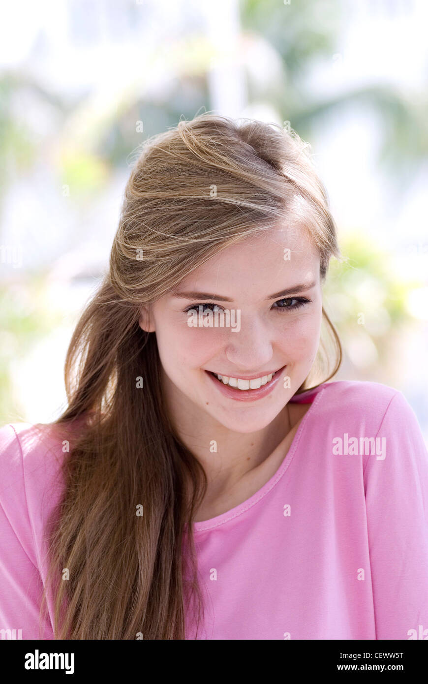 Female Long Straight Light Brown Hair Wearing Pink Round Neck