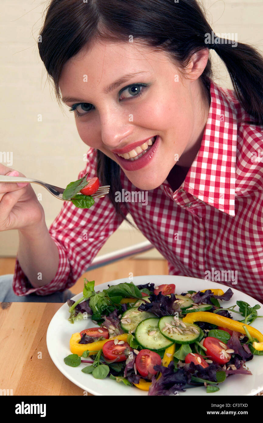 Female Brunette Hair Off Face Wearing Red And White Checked Shirt