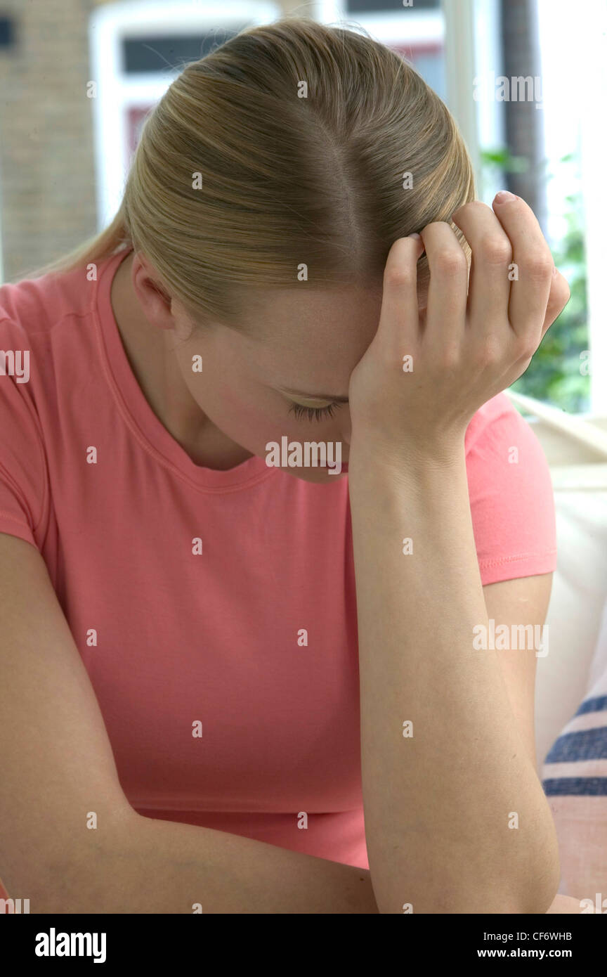 Female Blonde Hair Off Face Wearing Pink T Shirt And Orange And White