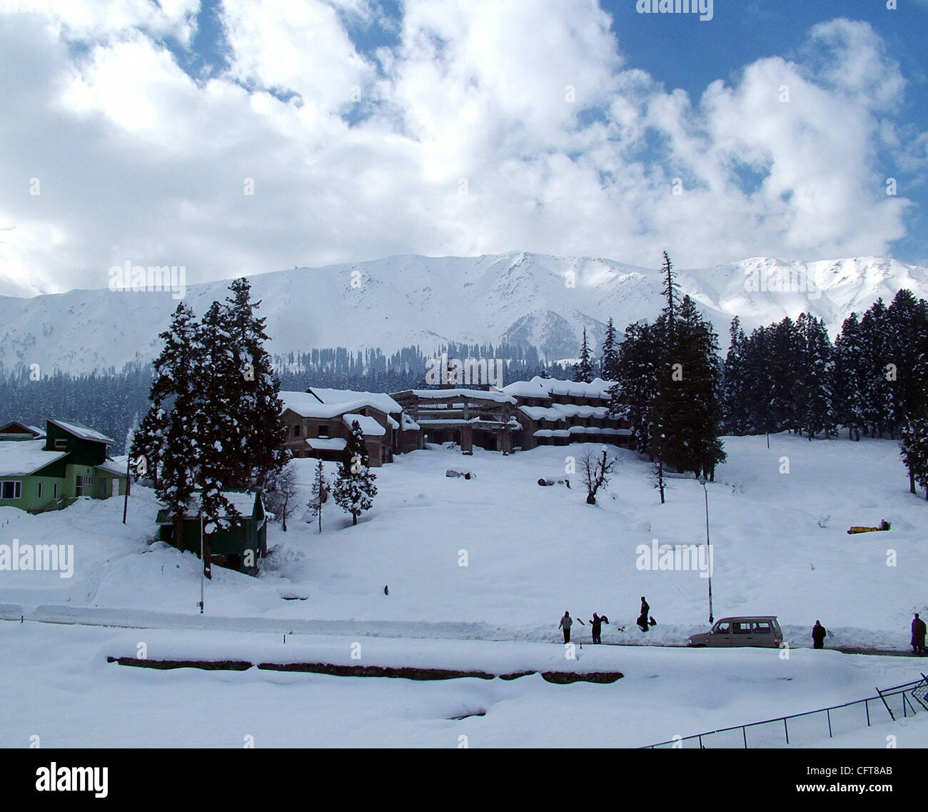A beautiful view of snow covered trees and houses in gulmarg kashmir famous in whole world