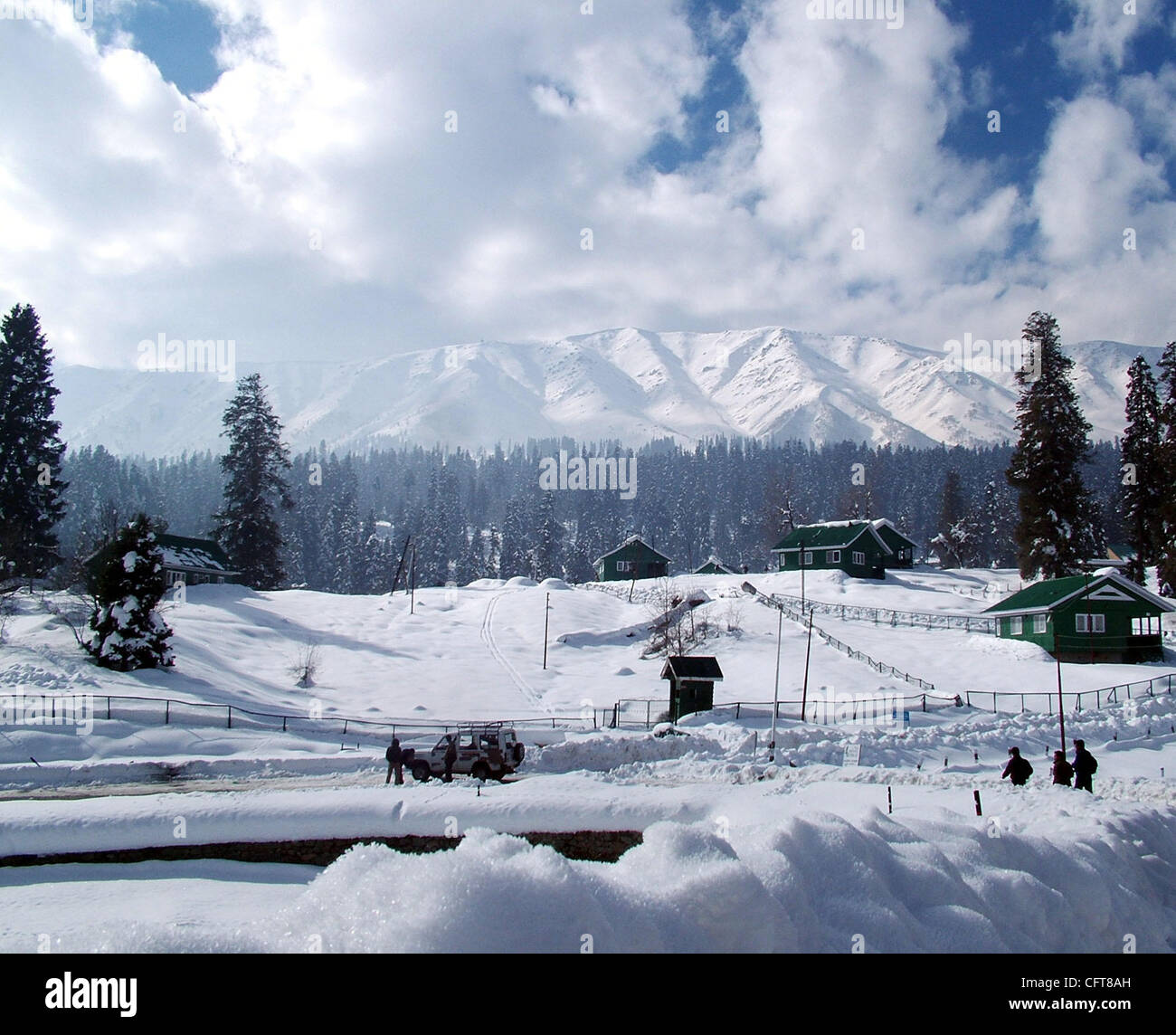 A beautiful view of snow covered trees and houses in gulmarg kashmir famous in whole world