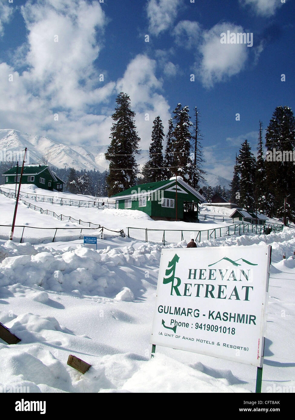 A beautiful view of snow covered trees and houses in gulmarg kashmir famous in whole world