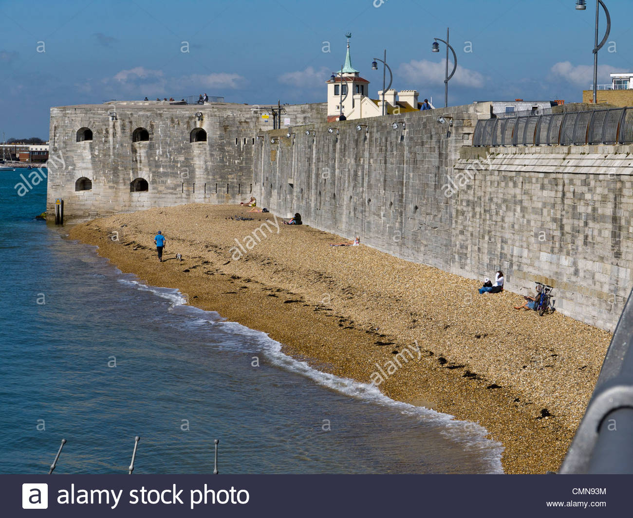People enjoying the March Sun at the Hot Walls old Portsmouth England