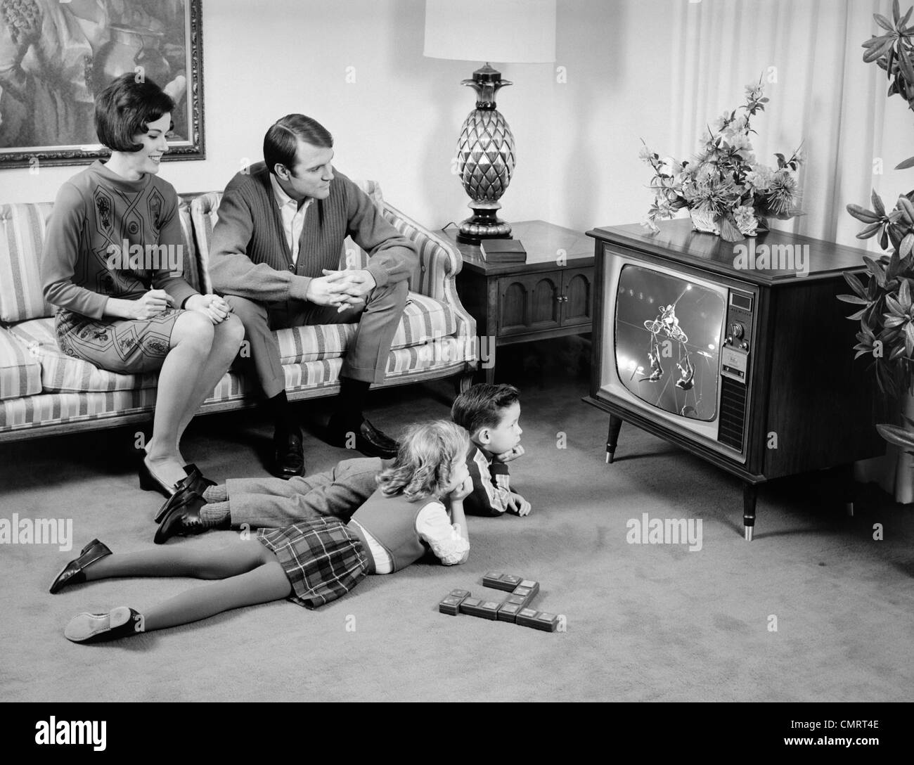 [Image: 1960s-family-of-4-watching-television-in...CMRT4E.jpg]