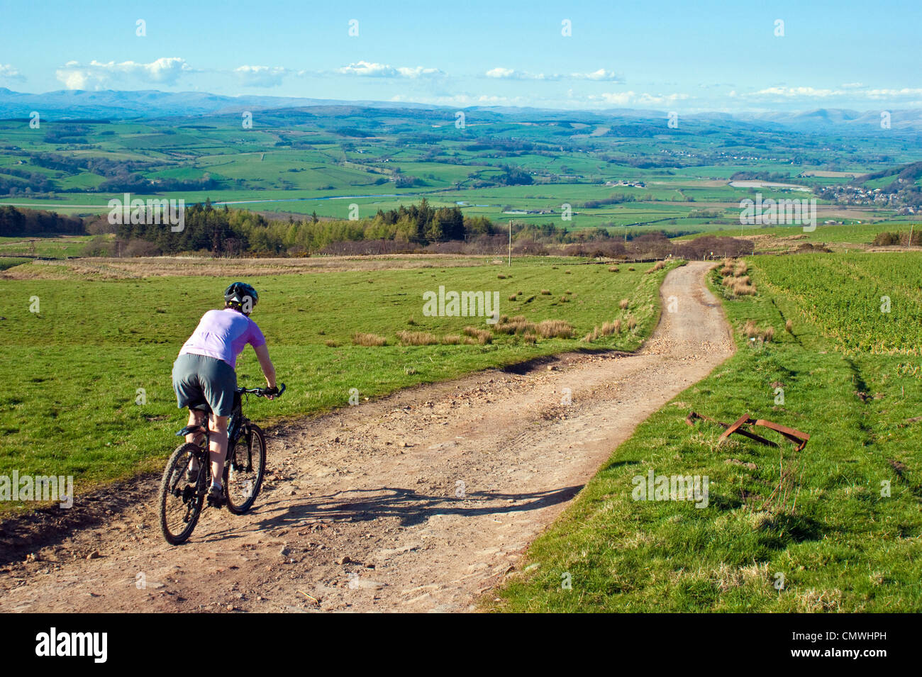 female-mountain-biker-descending-on-cato