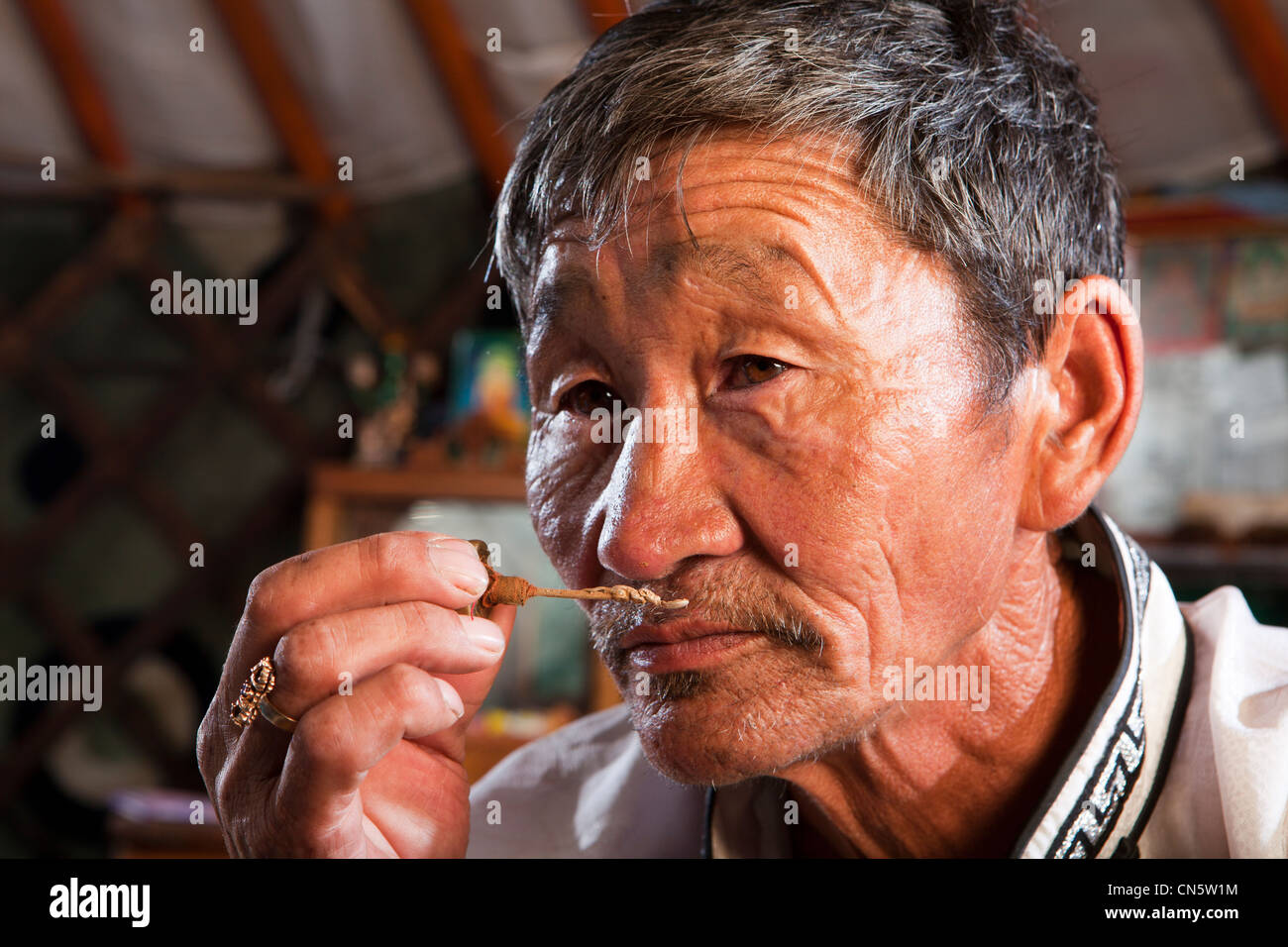 mongolian-man-smelling-traditional-aroma