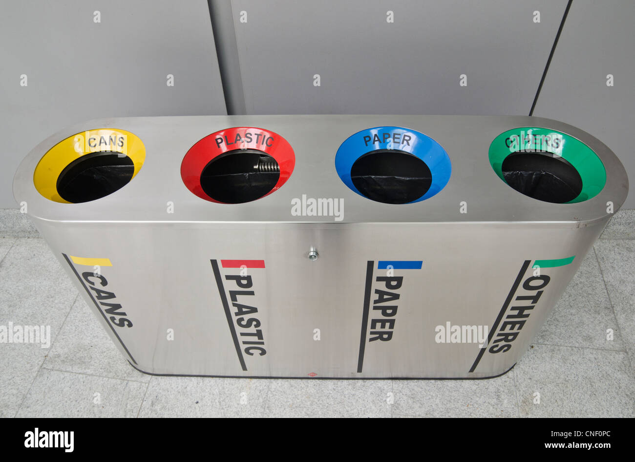 Recycling bins separating rubbish into four sorting holes Stock Photo