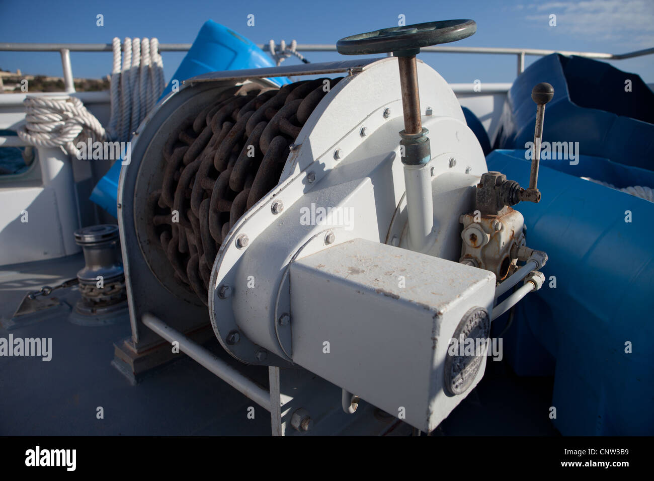 An Anchor Winch on the Forward Deck of a ship Stock Photo, Royalty Free