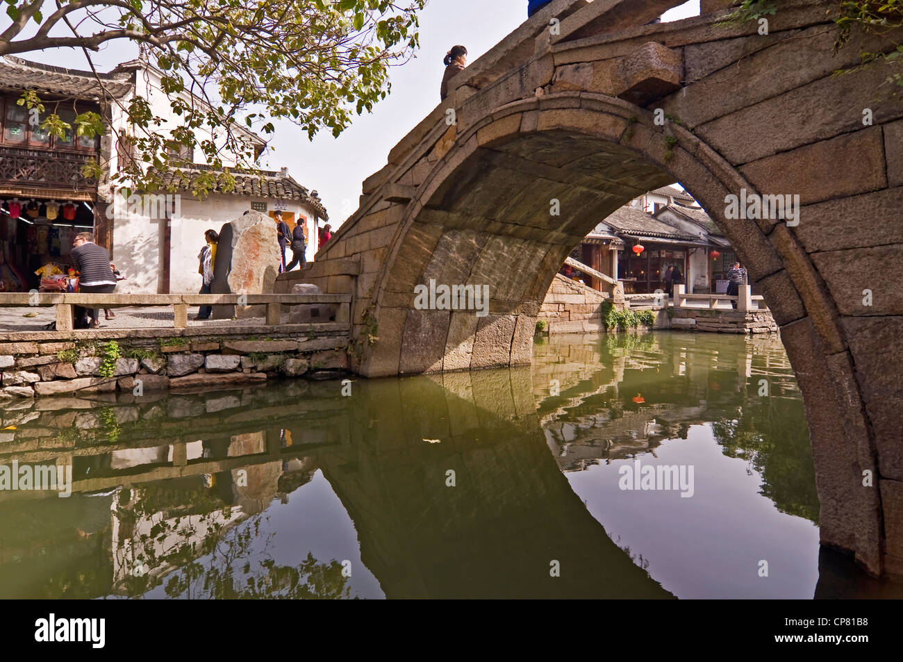 Stone Rounded Chinese Bridge On A Canal In Zhouzhuang Watertown Near