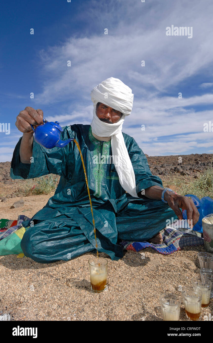 Touareg pouring tea, tea ceremony, Algeria, Sahara Stock Photo