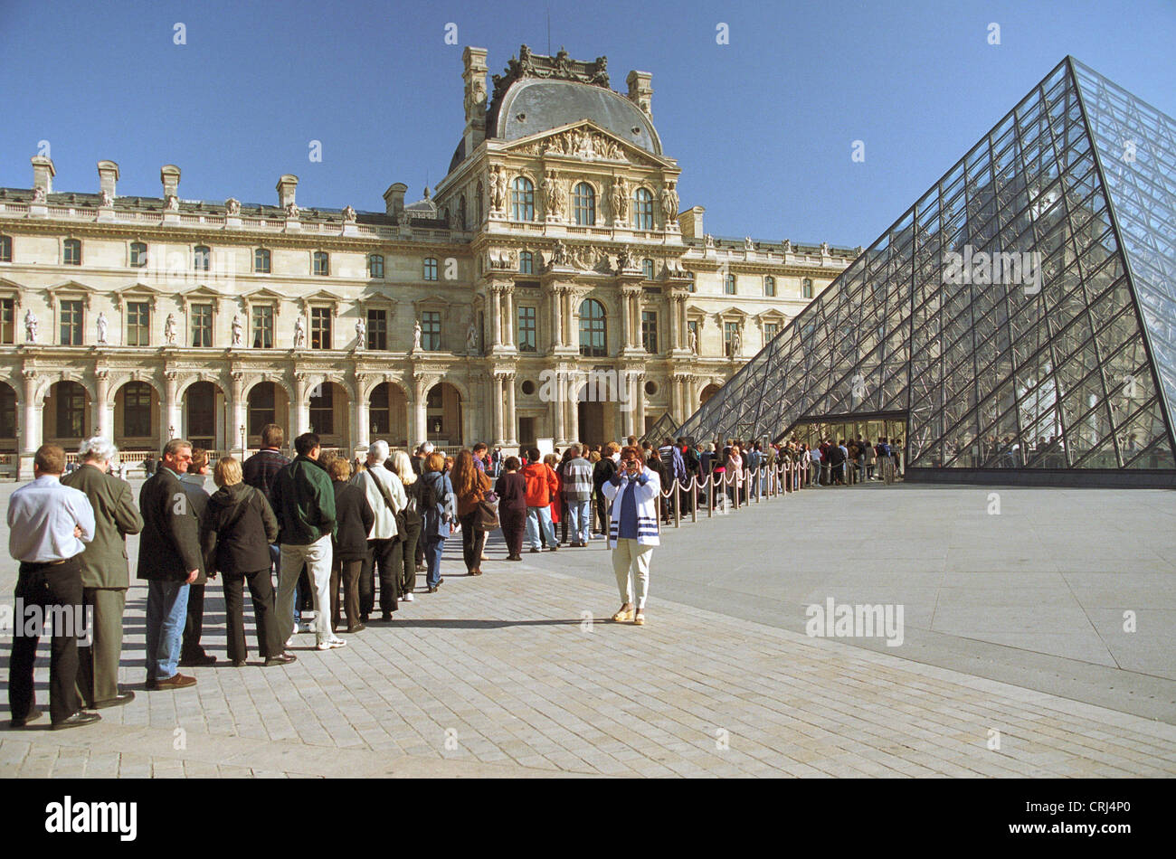 Queue at the entrance to the exhibition at the Louvre in Paris Stock