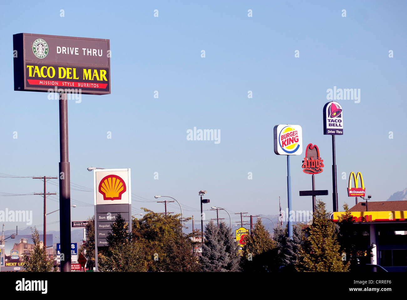 giant-signs-advertising-fast-food-chain-restaurants-tower-above-stock