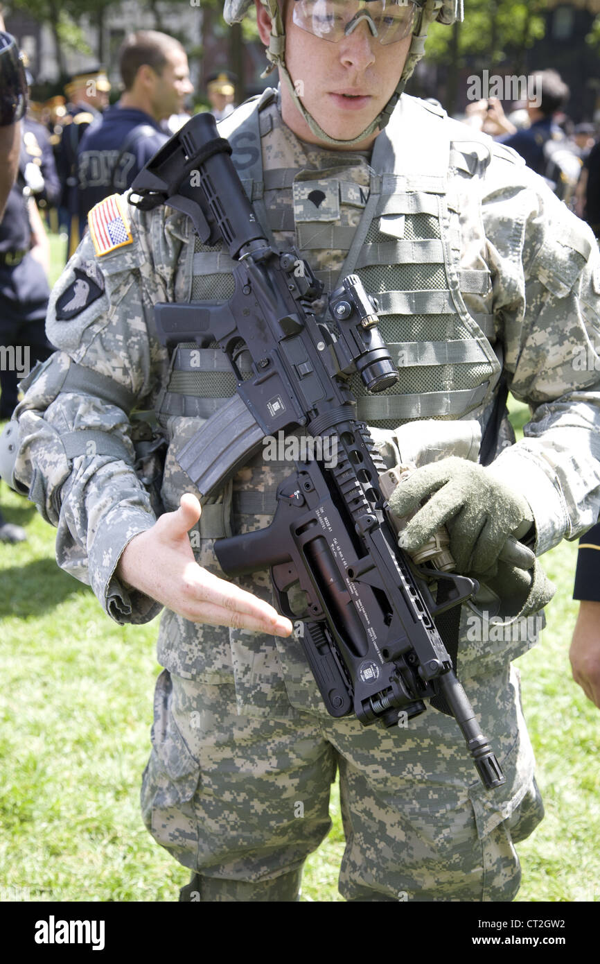 Army recruit displays the high tech standard issue M4 Carbine with
