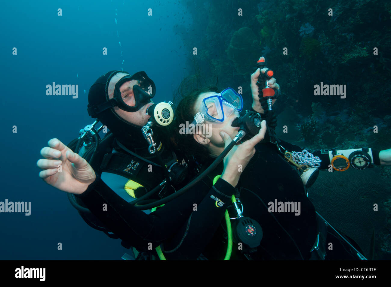 Diver gives air to unconscious diver Stock Photo, Royalty Free Image