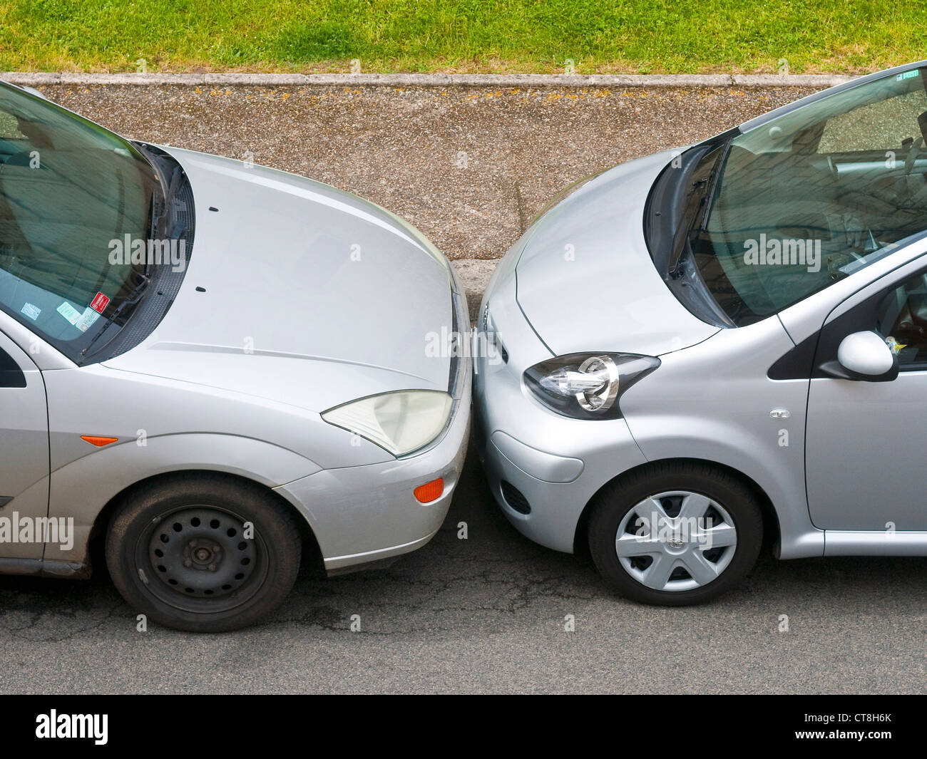 Two cars badly parked bumper to bumper France Stock Photo 49361611