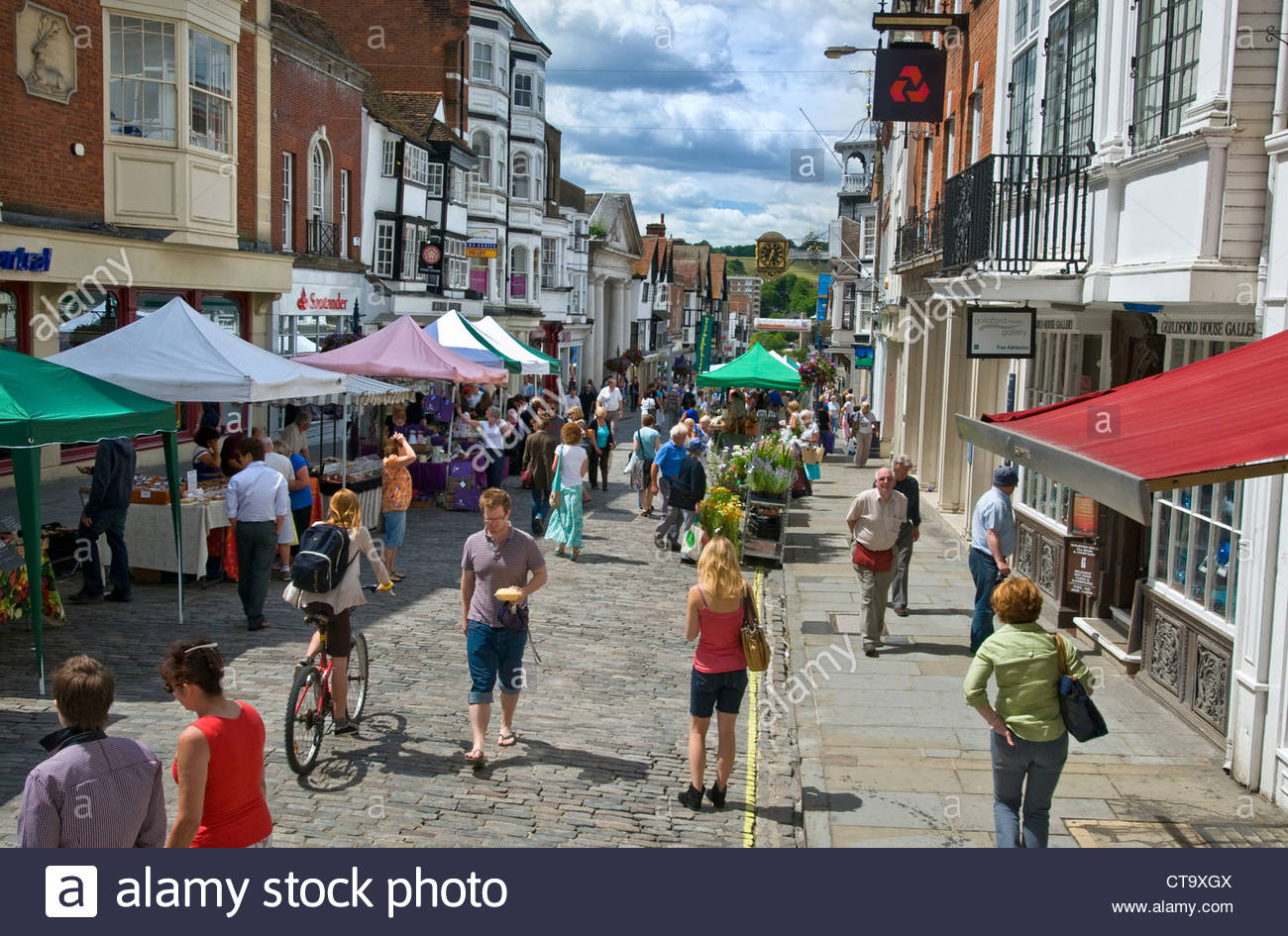 Guildford historic High Street and shoppers on a busy summer market