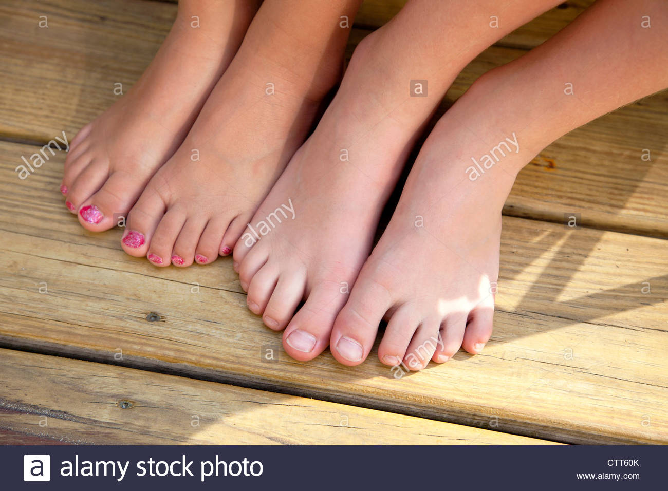 Two Pairs of Girl #39 s Bare Feet One With Painted Toenails Stock Photo Two Pairs of Girl #39 s Bare Feet One With Painted Toenails Stock Photo