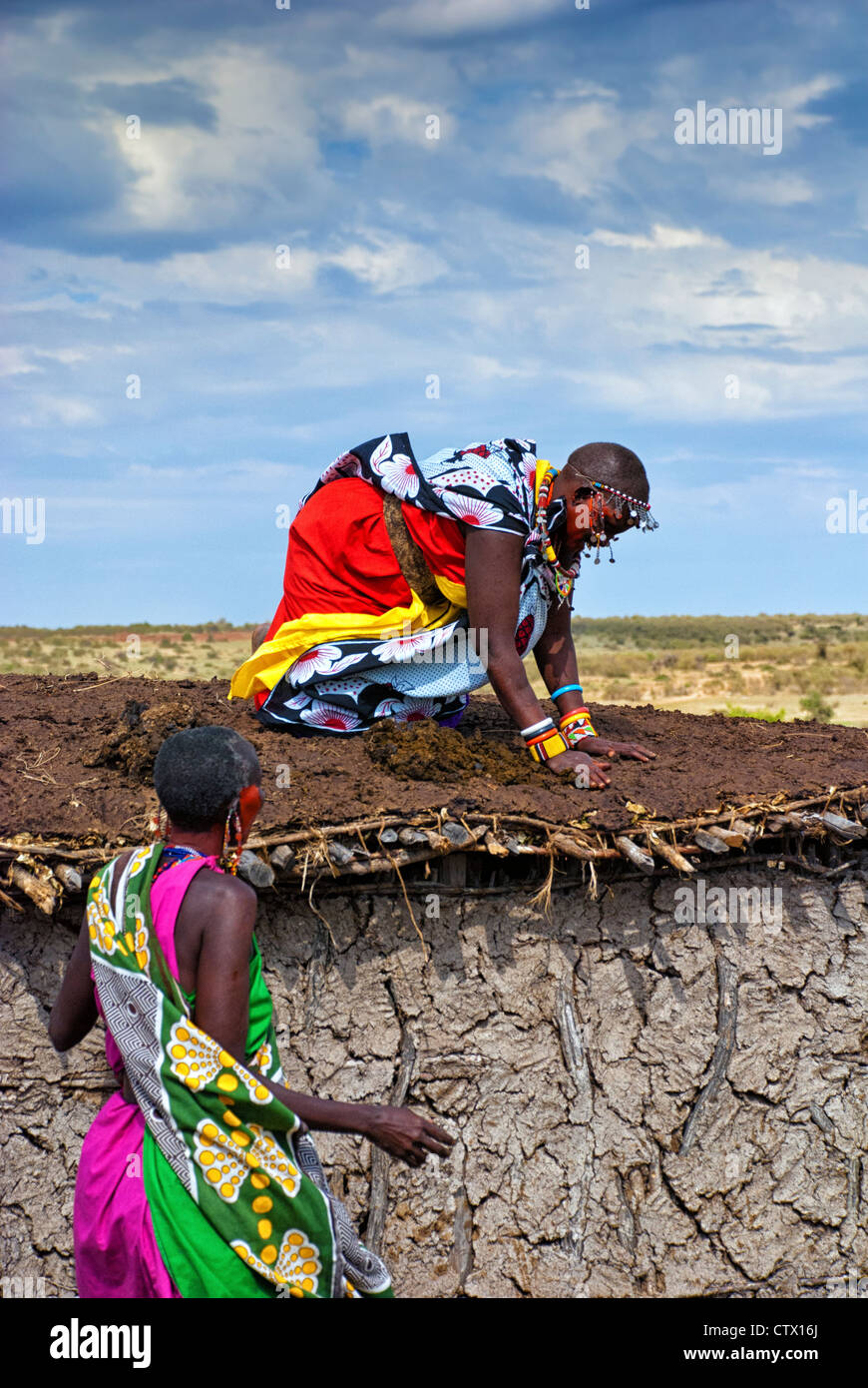 masai-woman-applying-a-mixture-of-cattle