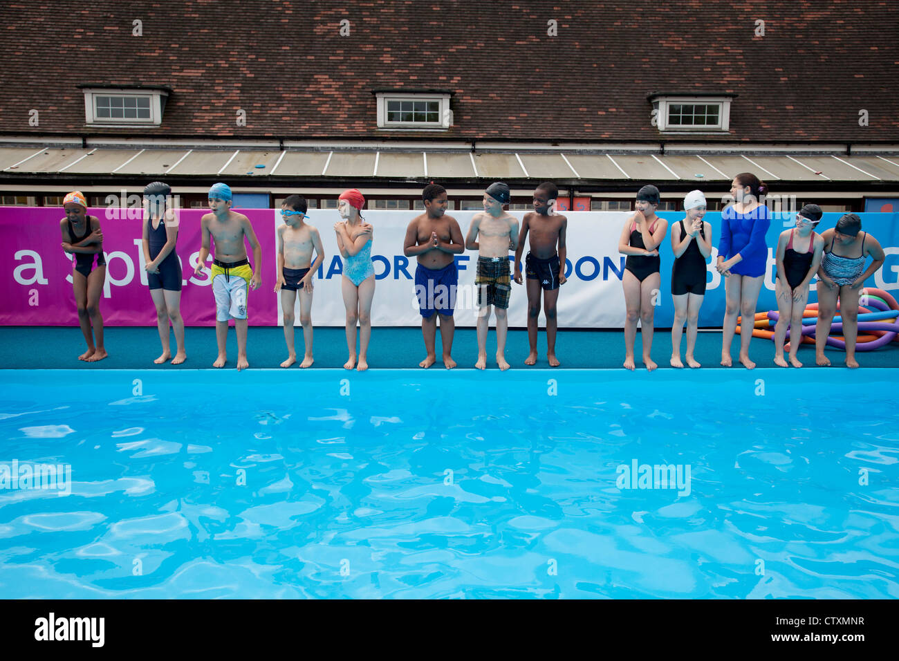 Primary School children, London, UK, take part in a swimming pool Stock