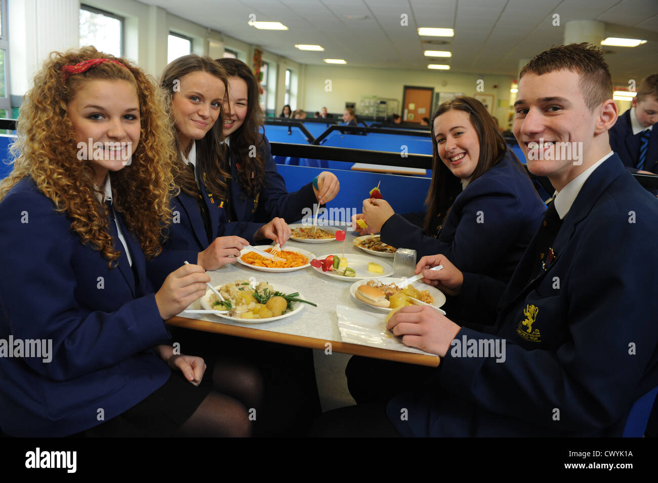 Secondary school pupils in school canteen eating lunch Stock Photo