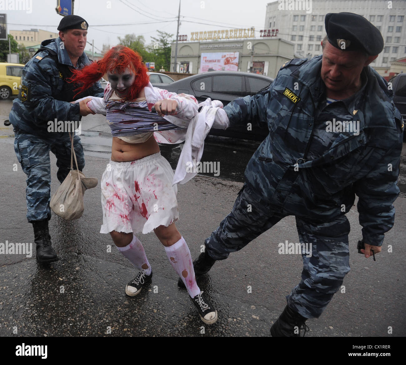 Moscow, Russia. May 15. 2011. Omon Policemen Detain A Girl, Zombie
