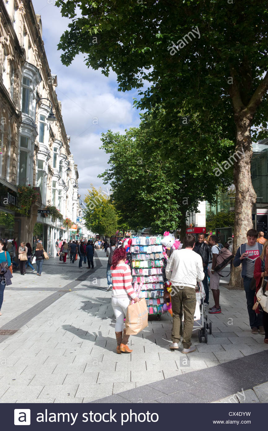 Shoppers and shops Queen Street, Cardiff, Wales Stock Photo, Royalty