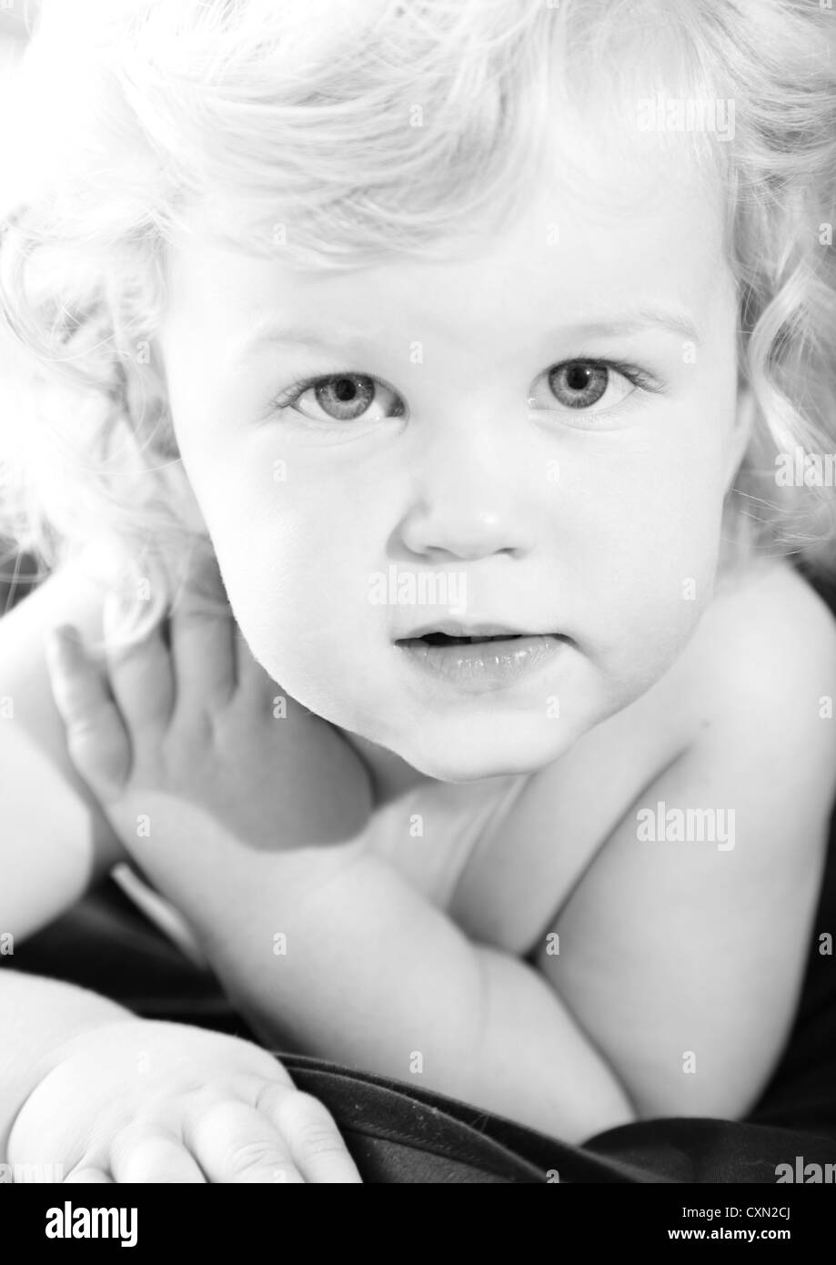 Cute Baby Boy With Curly Blond Hair Black And White Stock Photo
