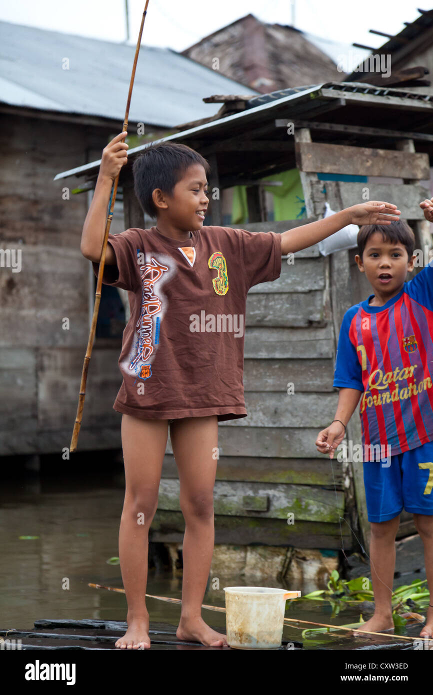 Joyful Children playing at the Canals in Banjarmasin, Indonesia Stock